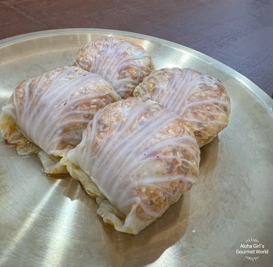 Cabbage dumplings made with kimchi filling wrapped in napa cabbage leaves