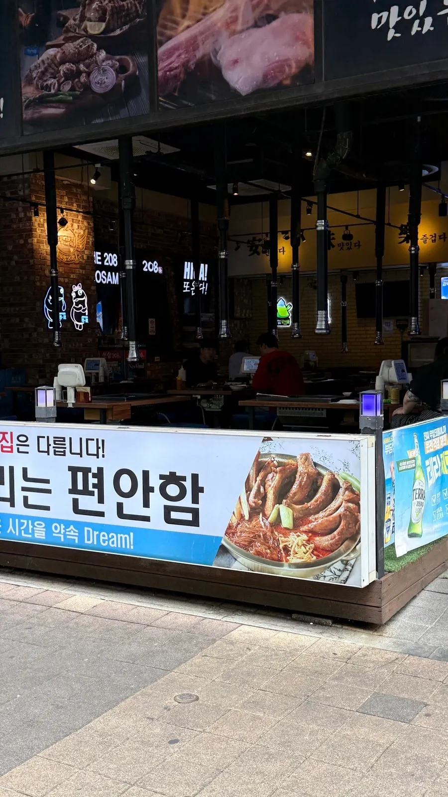 Restaurant interior with floor-to-ceiling front windows