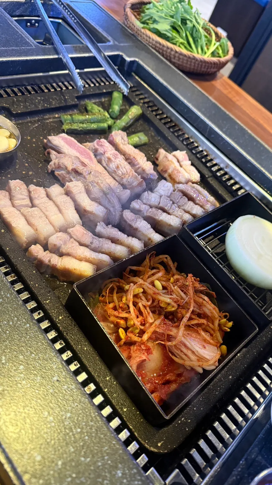 Staff grilling charcoal-seared pork