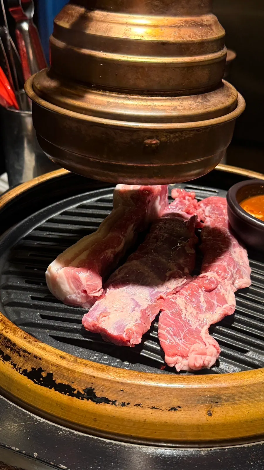 Pork grilled by a staff member