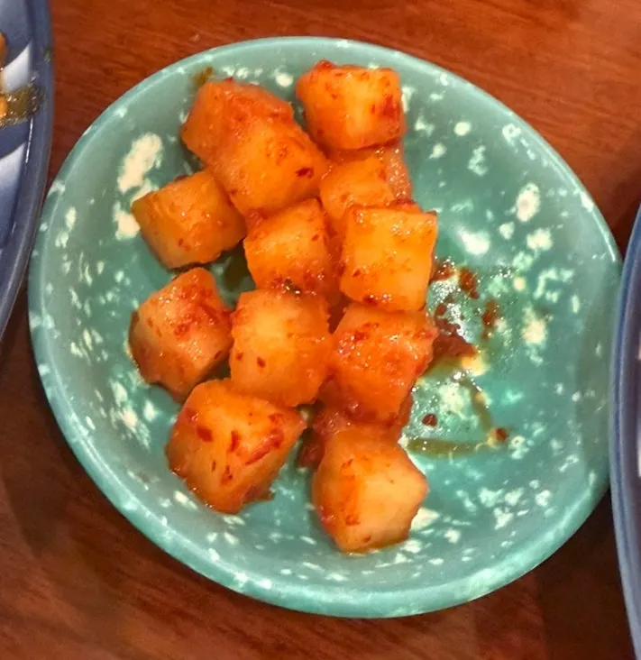 Complimentary tteokbokki and basic side dish information