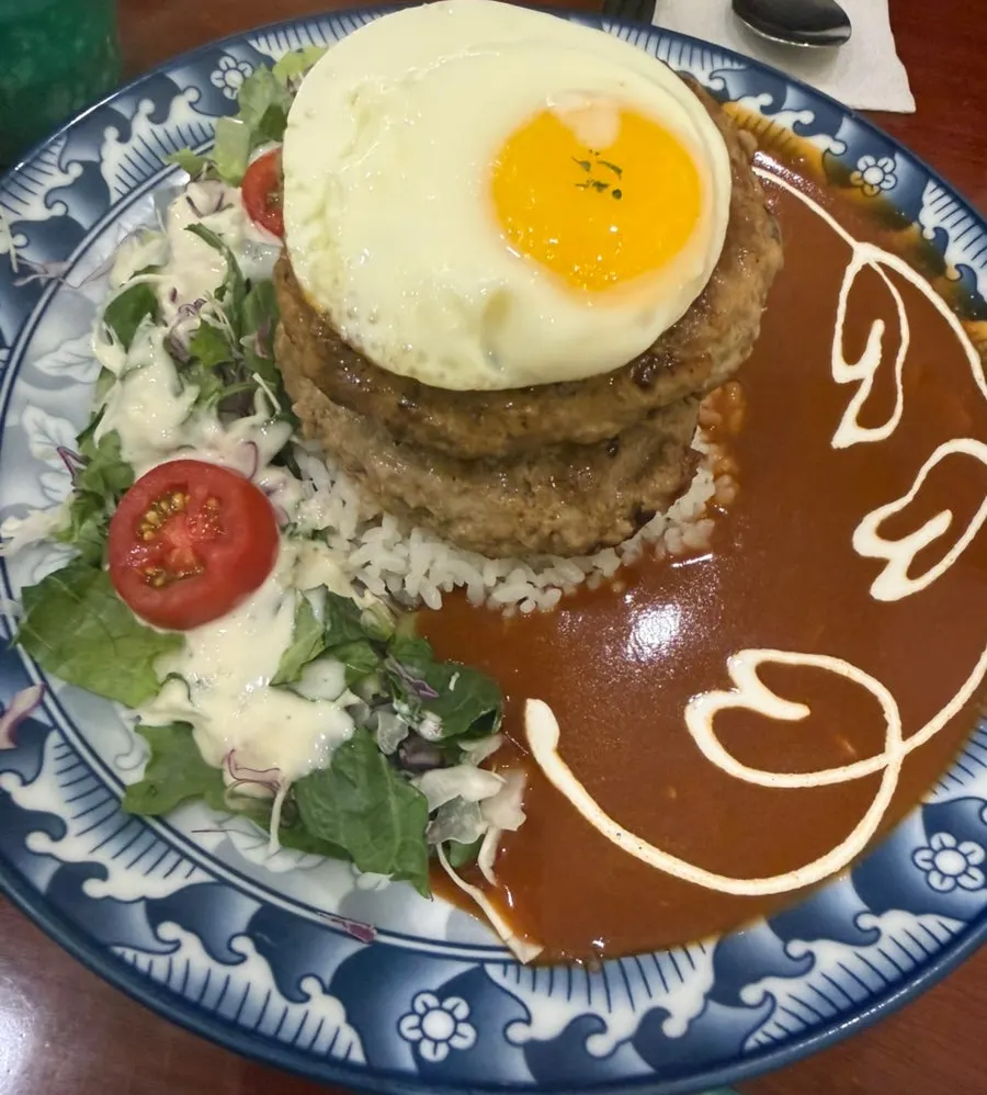 Double hamburg steak topped with a soft-yolk fried egg