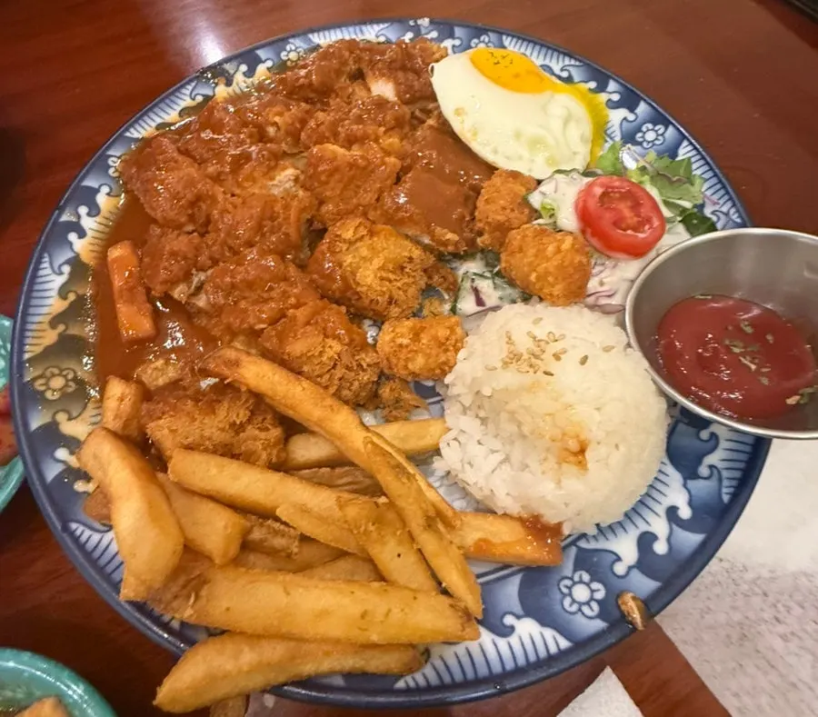 Pork cutlet served with French fries