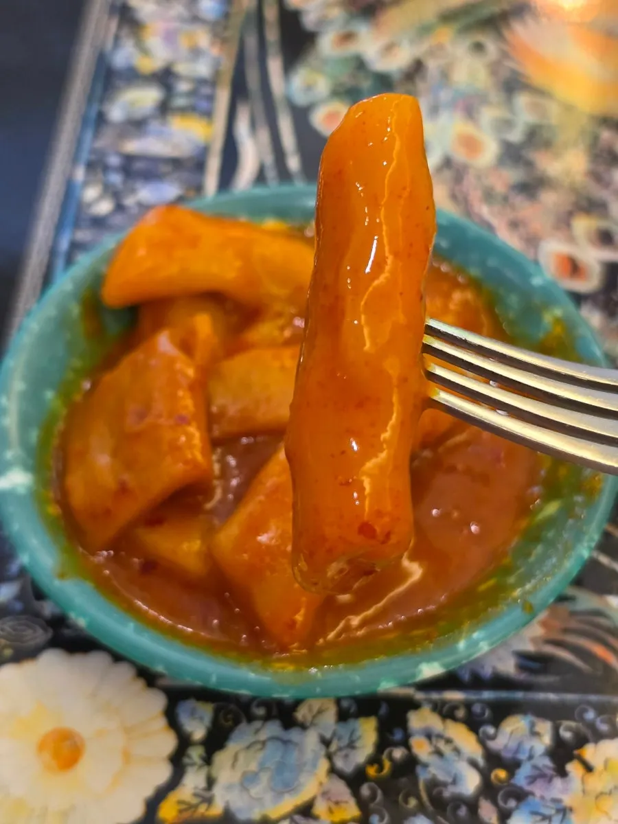 Tteokbokki served on a retro plate