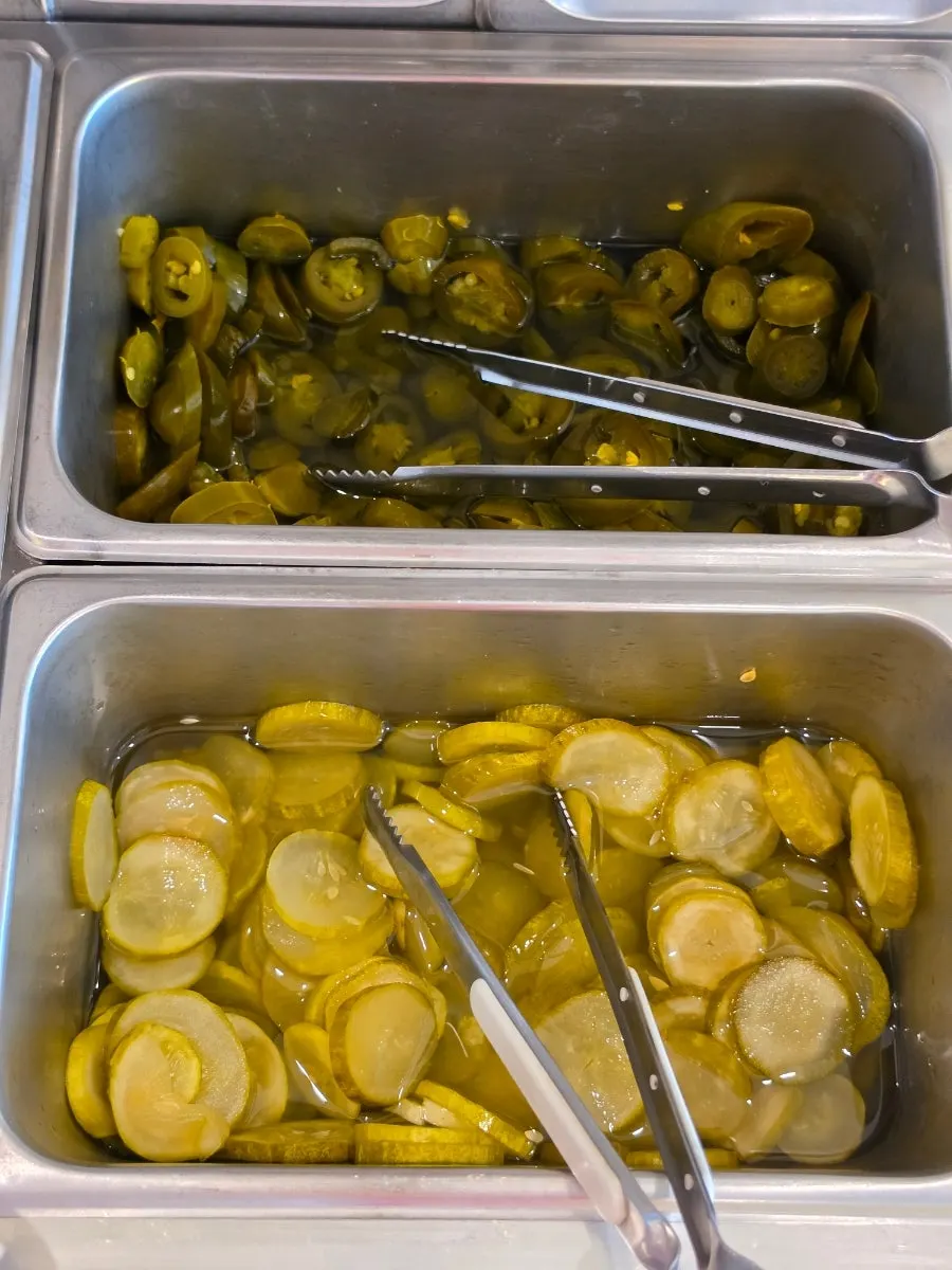 Self-service bar stocked with jalapeños
