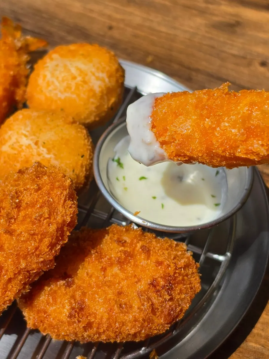 Assorted fried foods including croquettes