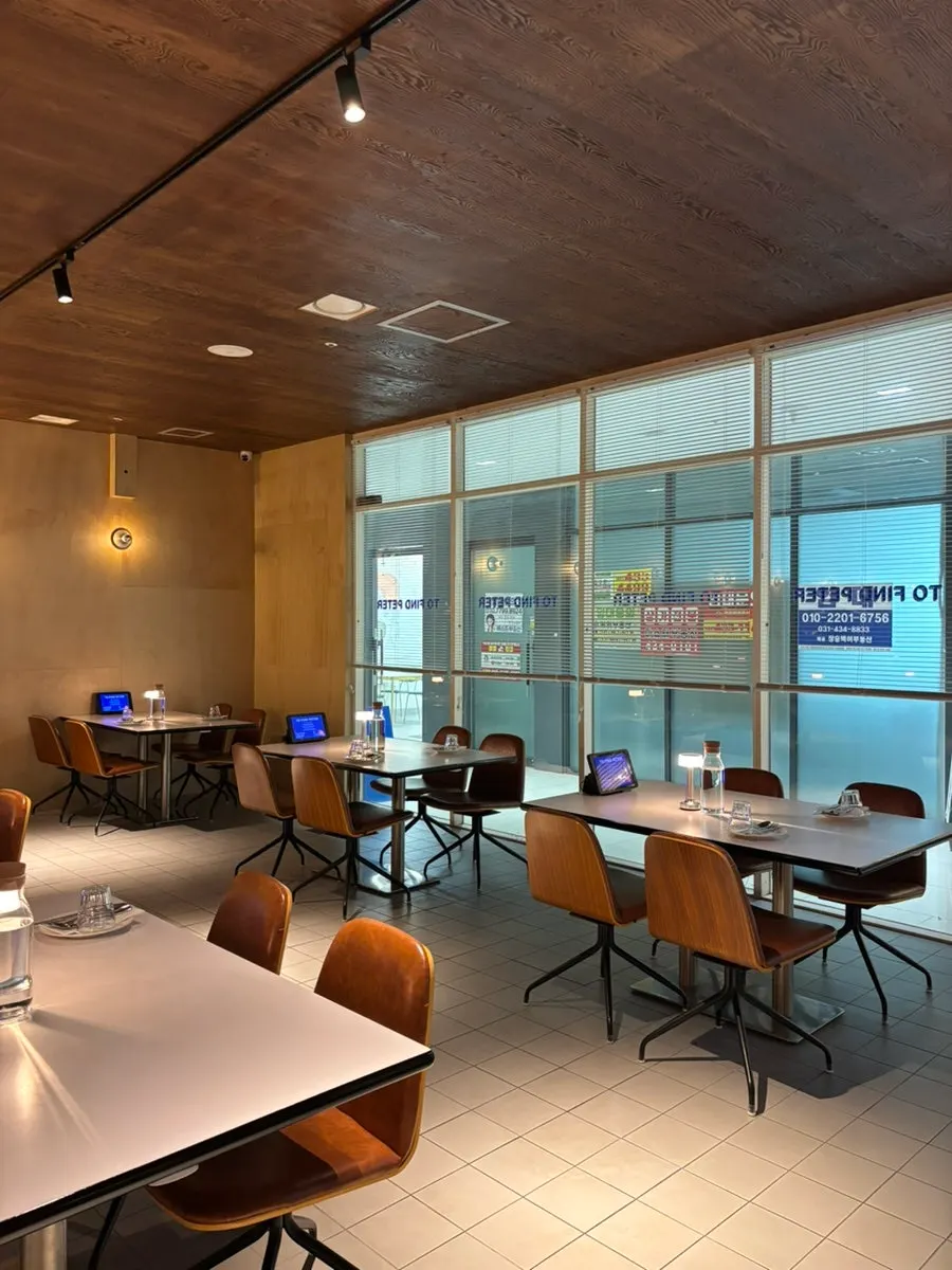 Spacious, tidy dining hall at Two Find Peter