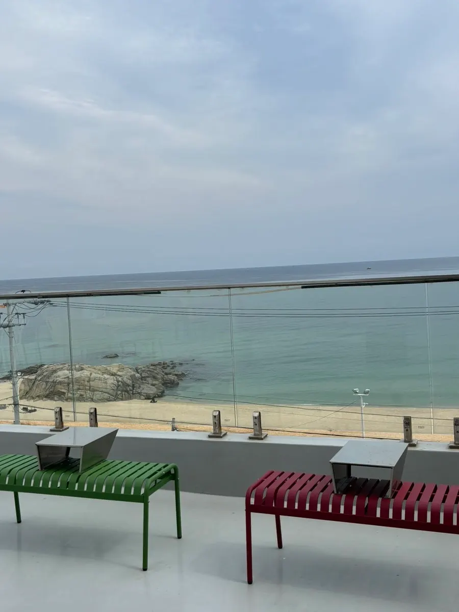 Ocean-view seating looking out at the sea through the window
