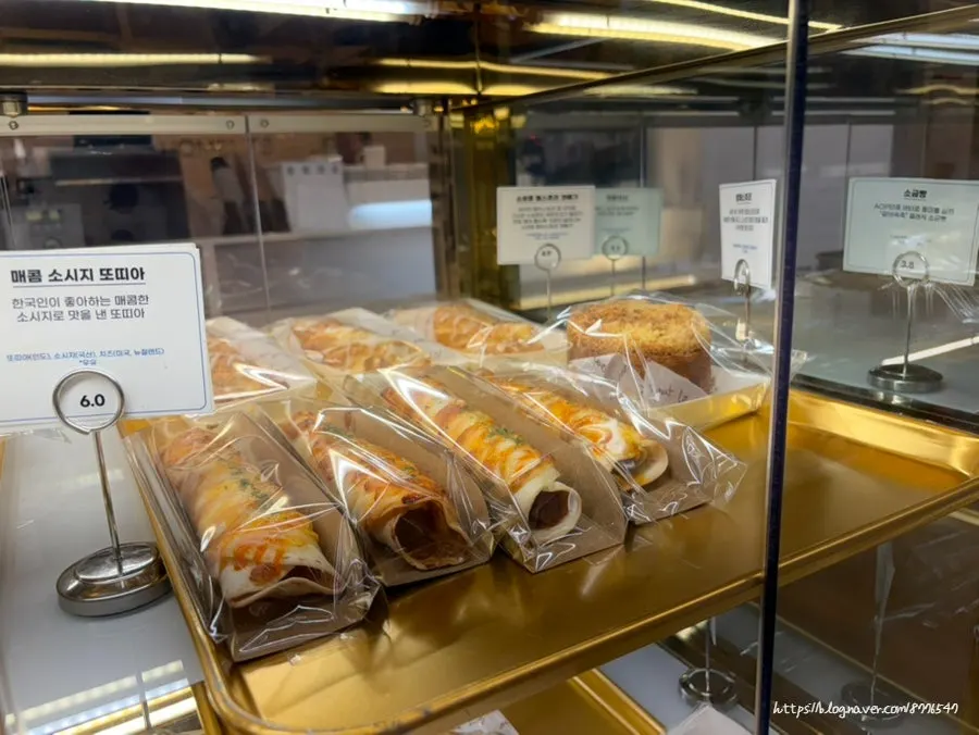 Bread display case at Baegya Coffee in the evening
