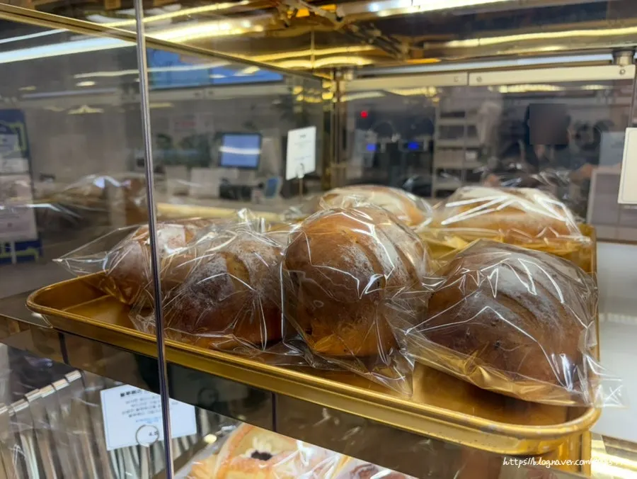 Close-up of the bread display case at Baegya Coffee