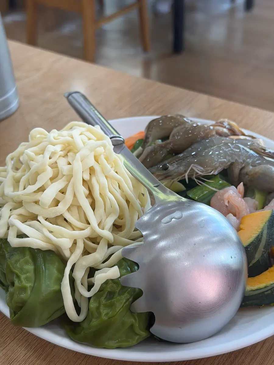 Plate loaded with seafood and vegetables for the jeongol