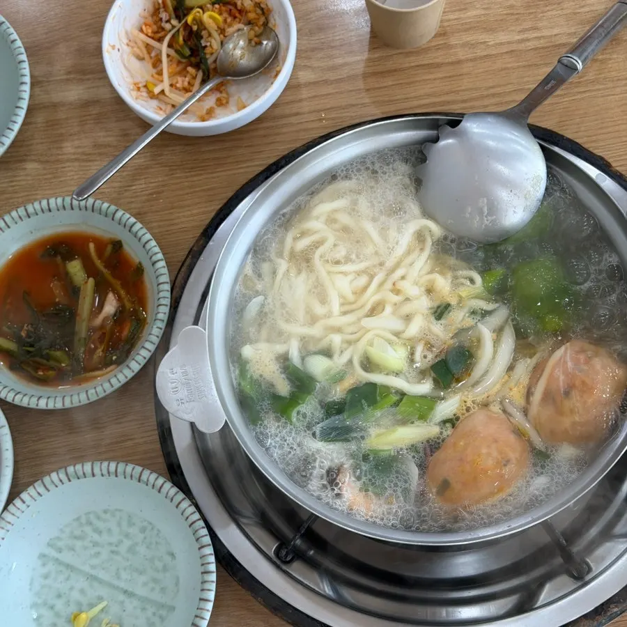 Kalguksu noodles and seafood served in a small dish