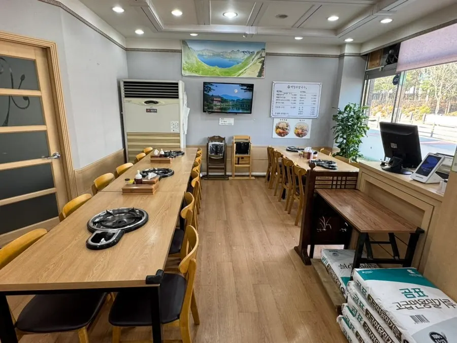 View of the floor-seating restaurant with tables for four