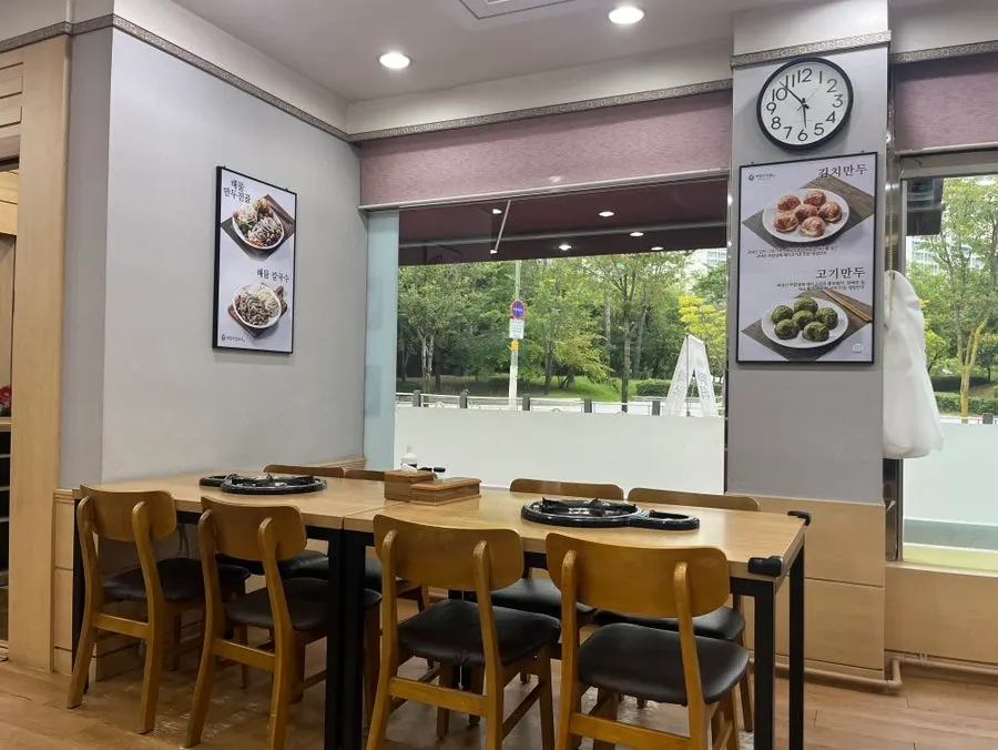 Table inside the restaurant, seated as the first dinner customers