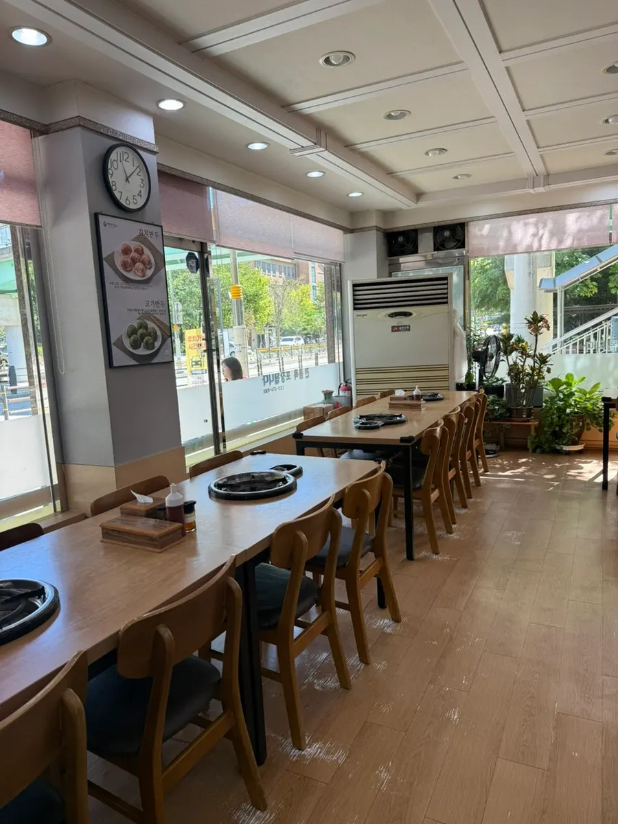 Spacious interior with long tables lined up