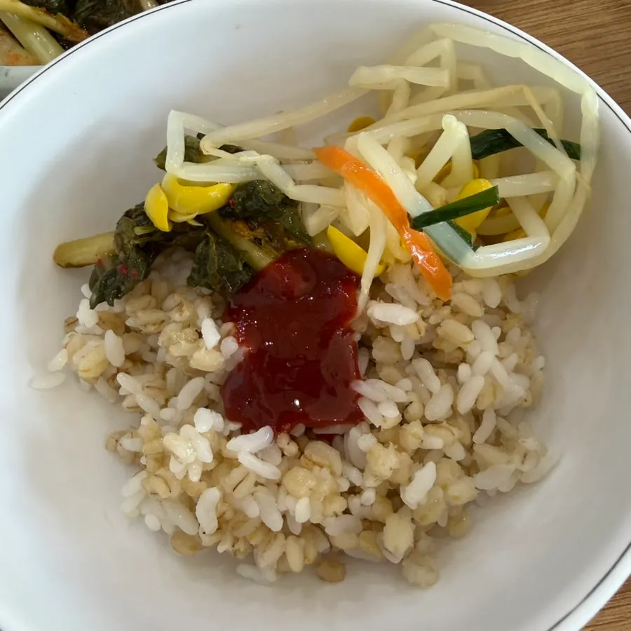 Barley rice mixed with yeolmu kimchi and bean sprouts