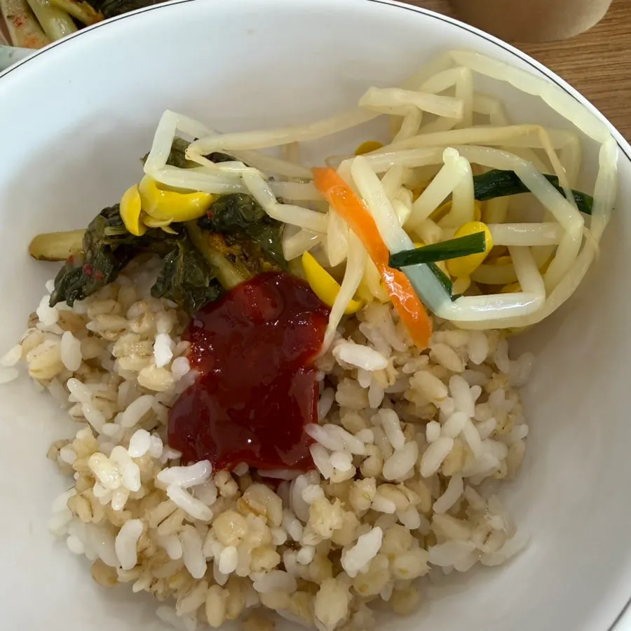 Barley bibimbap drizzled with sesame oil