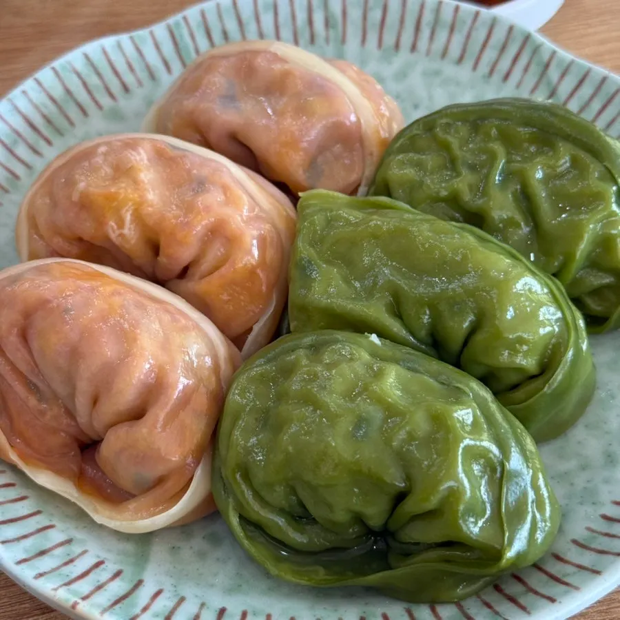 Close-up of the kimchi mandu with its reddish wrapper