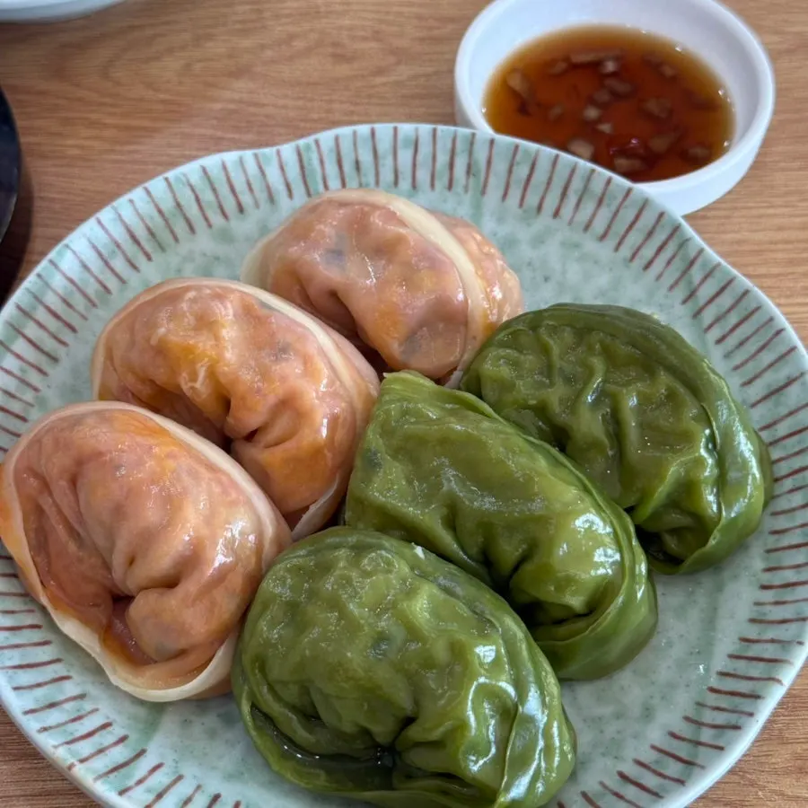 Close-up of the meat mandu with its greenish wrapper