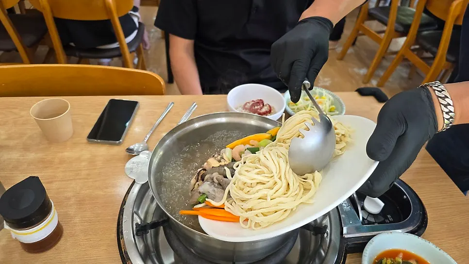 A finished bowl of seafood kalguksu