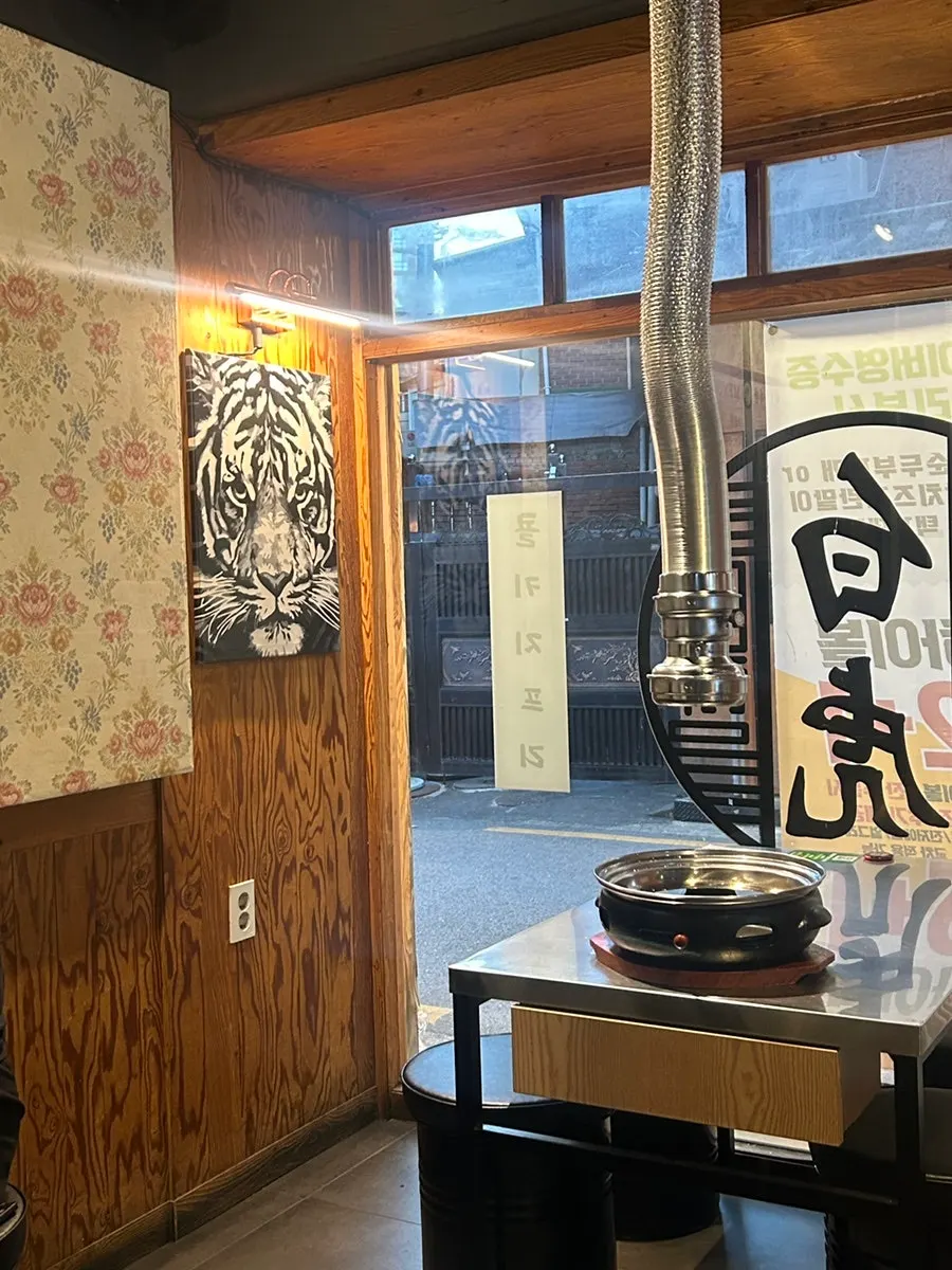 Dining hall interior with tables at Baekho Yangdaechang