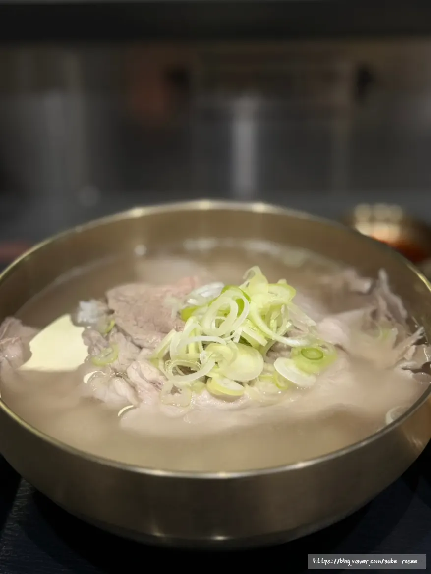 A bowl of clear pork gomtang loaded with meat