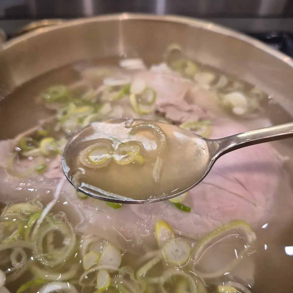 Toryeom pork gomtang piled with meat and scallions