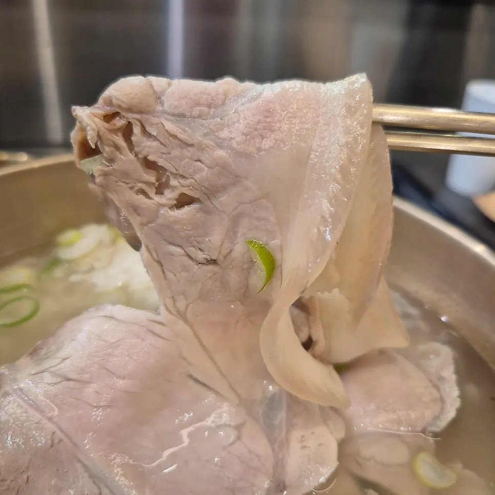 A bowl of pork gomtang with generous meat and steeped rice