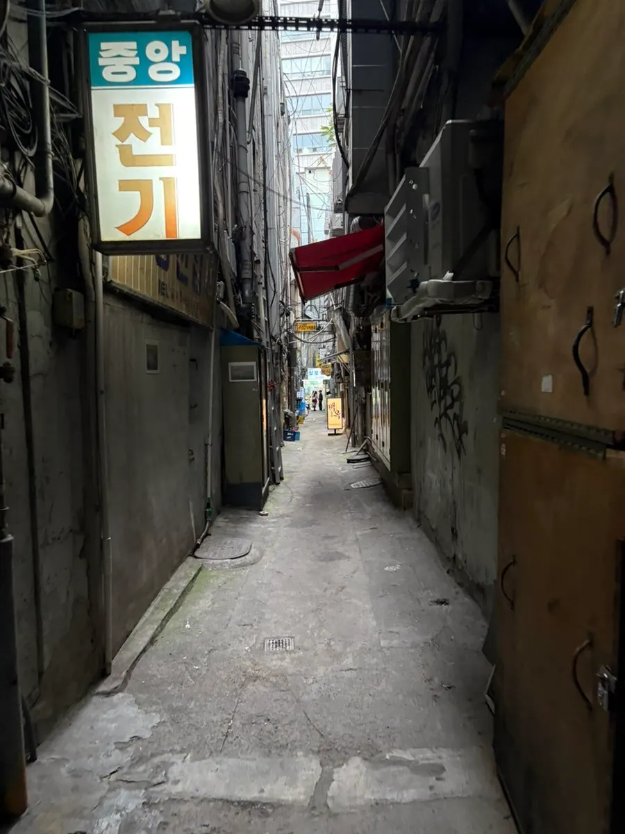 Baekok Myeongdong sign glowing in the alley