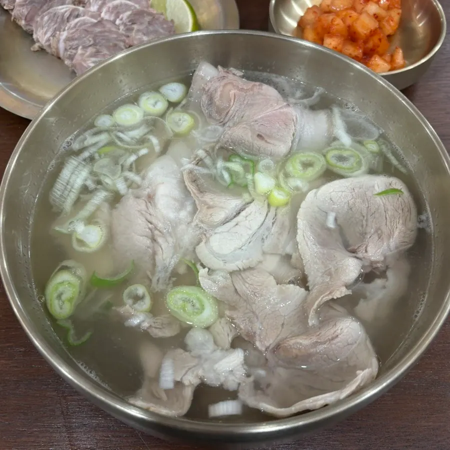 Plate of cold pork slices with lime and jeotgal