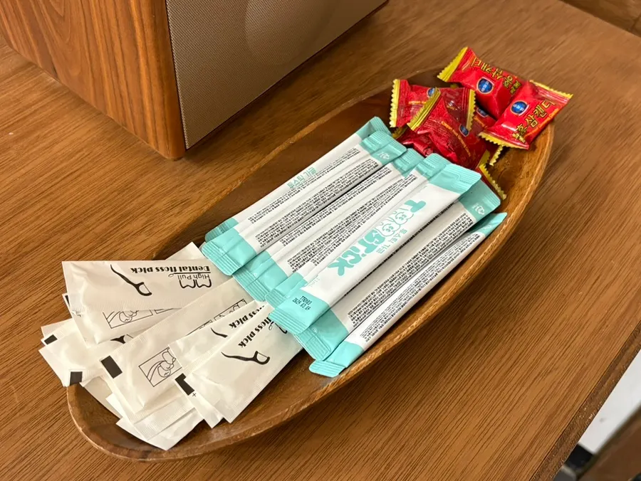Mouthwash, floss, and candy set out at the counter