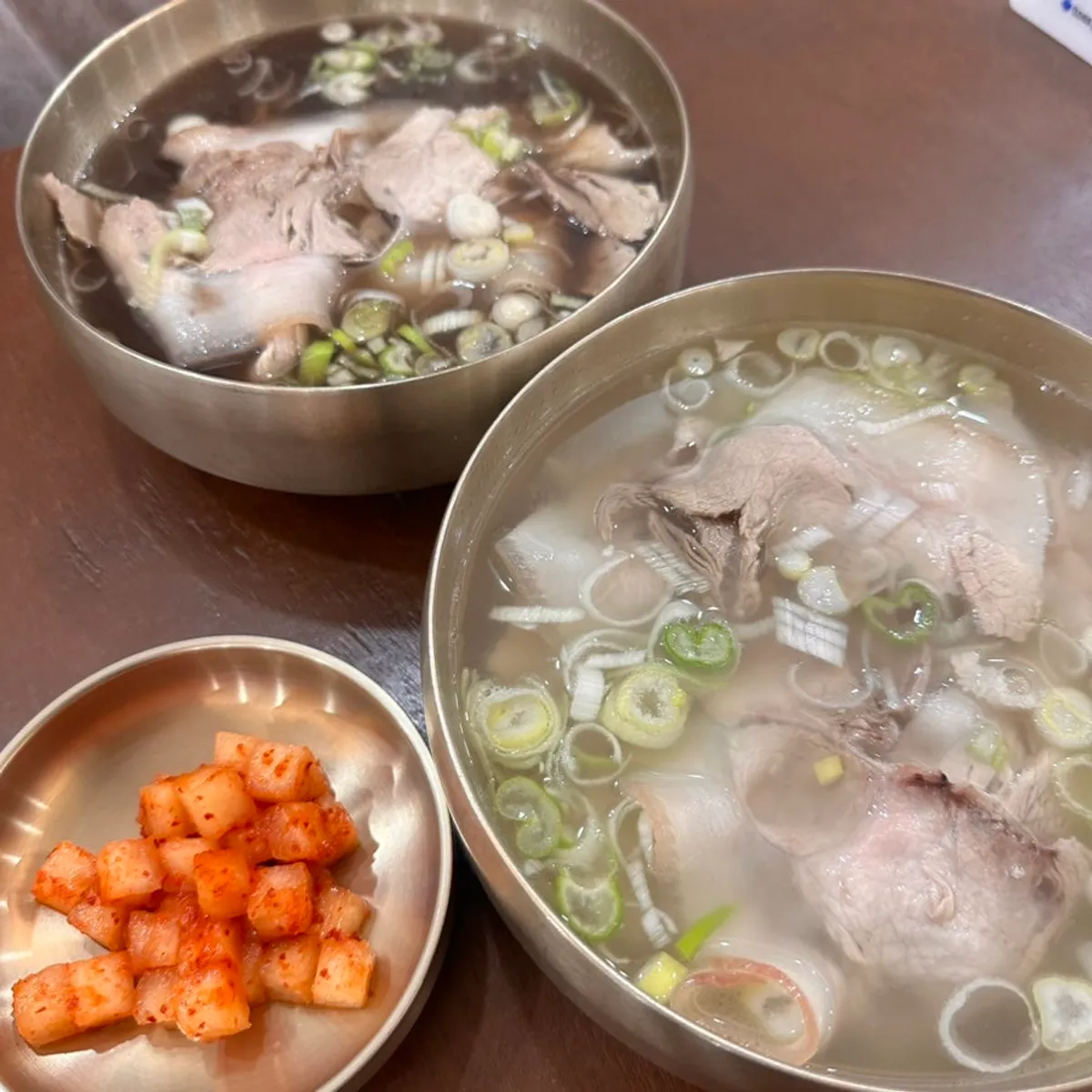 Table set with pork gomtang and yakgomtang