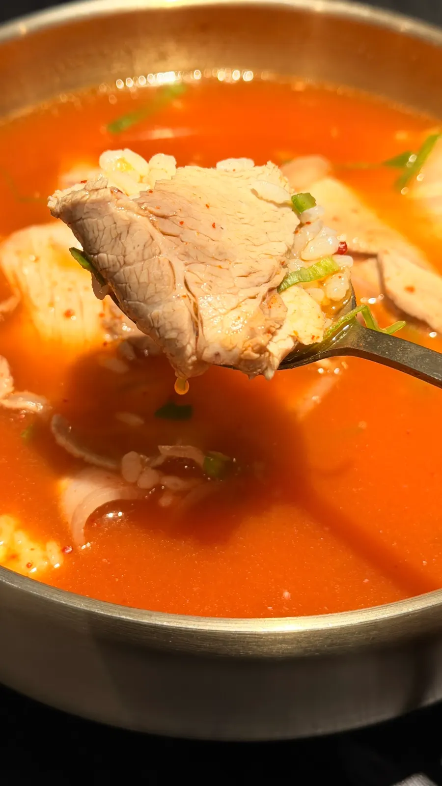 Yeol-gomtang topped with red seasoning