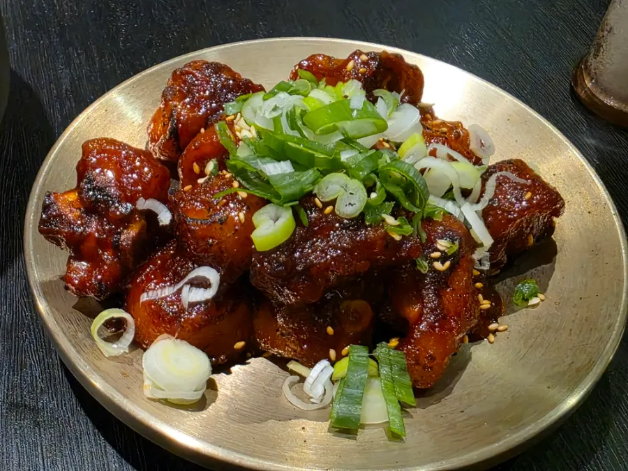 Table spread of pork gomtang at Baekok Yongsan, cover image