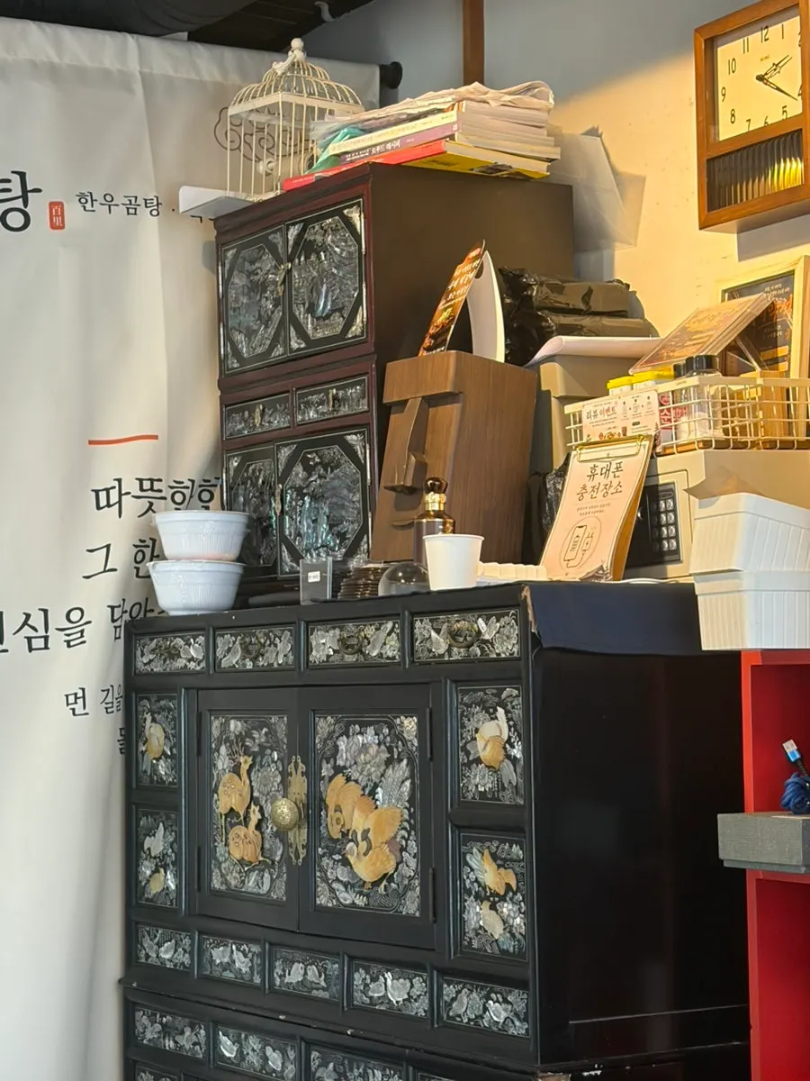 A corner of the restaurant with Korean decor pieces