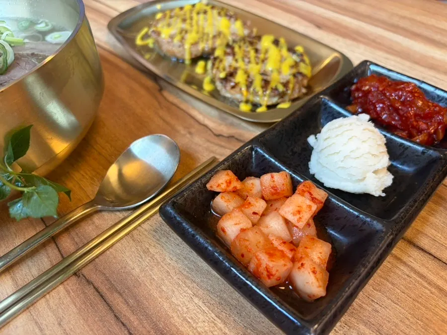 Basic banchan including squid jeotgal and potato salad