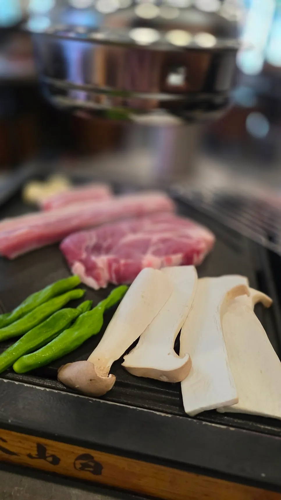 Meat and king oyster mushrooms on the grill