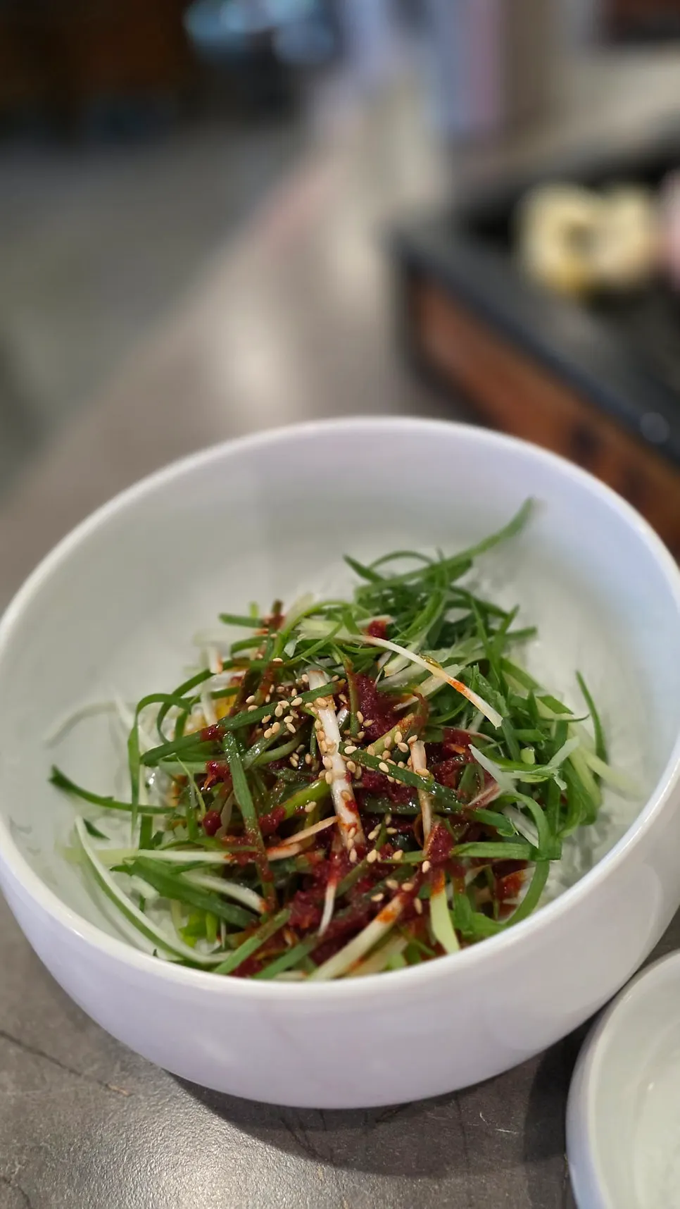 Barley kimchi fried rice topped with flying fish roe and seaweed flakes