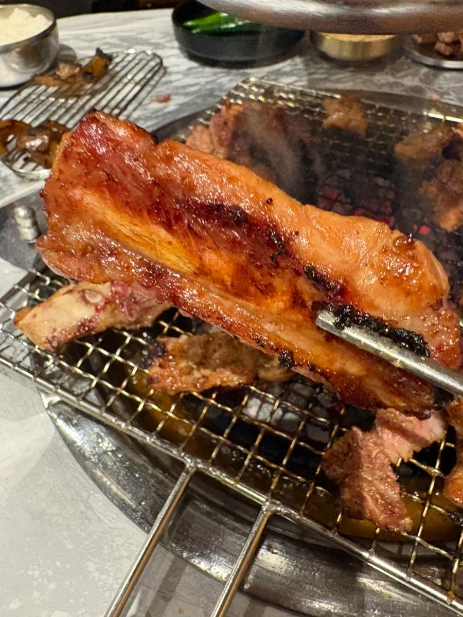 A golden-brown piece of jinjja dwaeji galbi