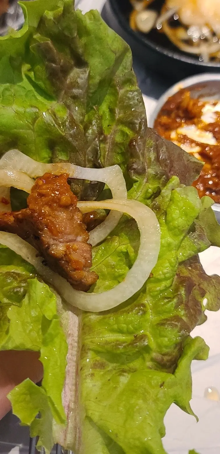 A wrap of pork galbi with vegetables