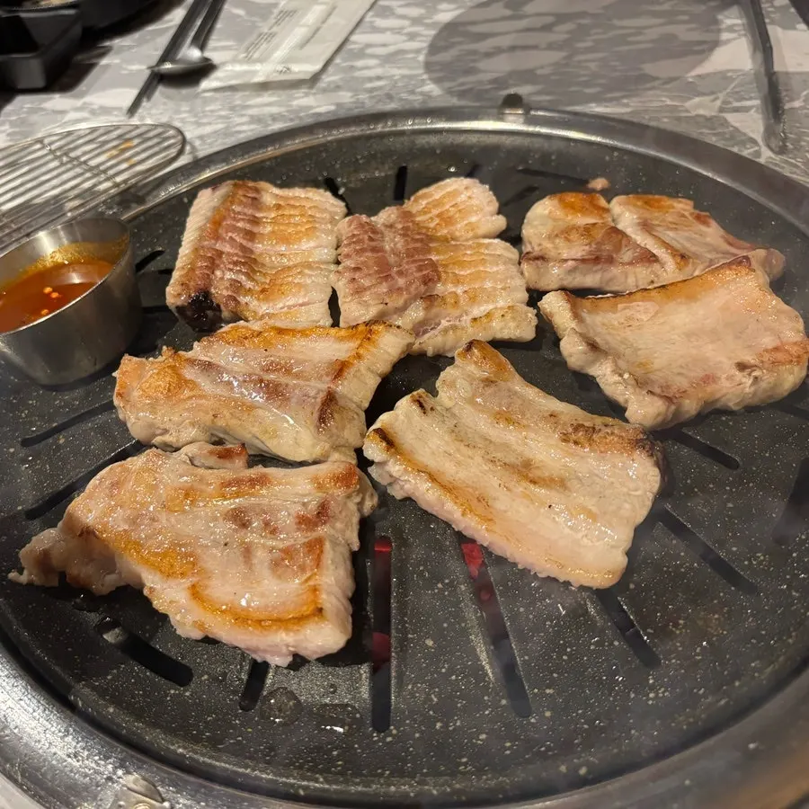 Bakpo raw galbi placed on the charcoal grill