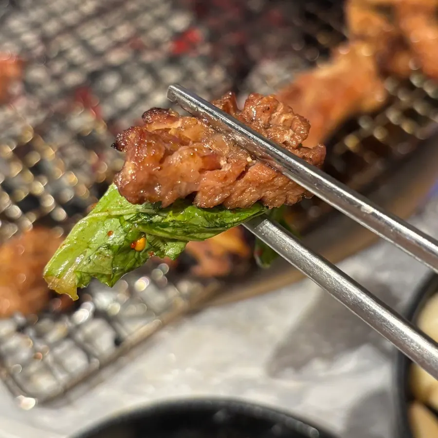 Grilling the seasoned pork galbi