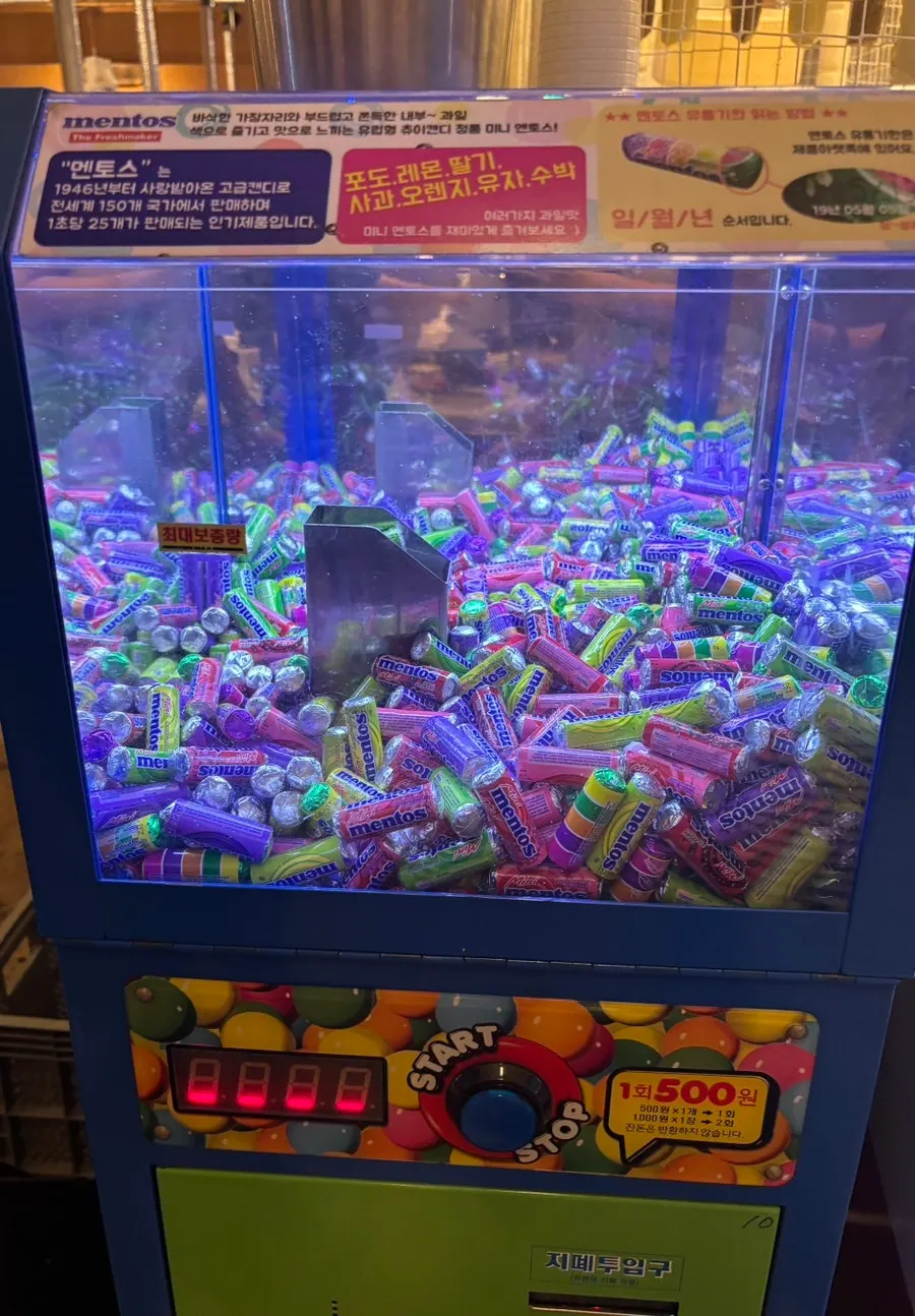 Kids' playroom with slushie and claw machines