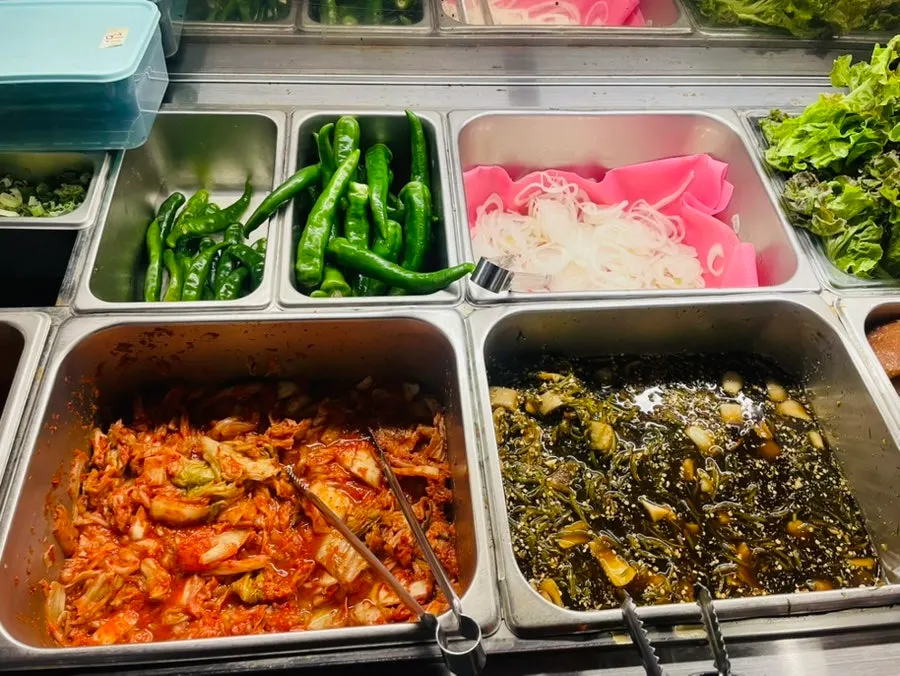 Garlic, chili peppers, and pickled onion at the self-bar