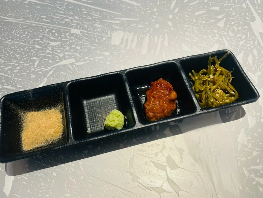 Plate of salt, wasabi, and seasoned sauce