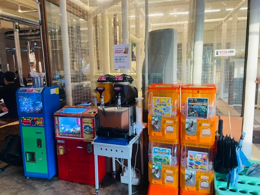Claw machine and slushie machine in front of the playroom