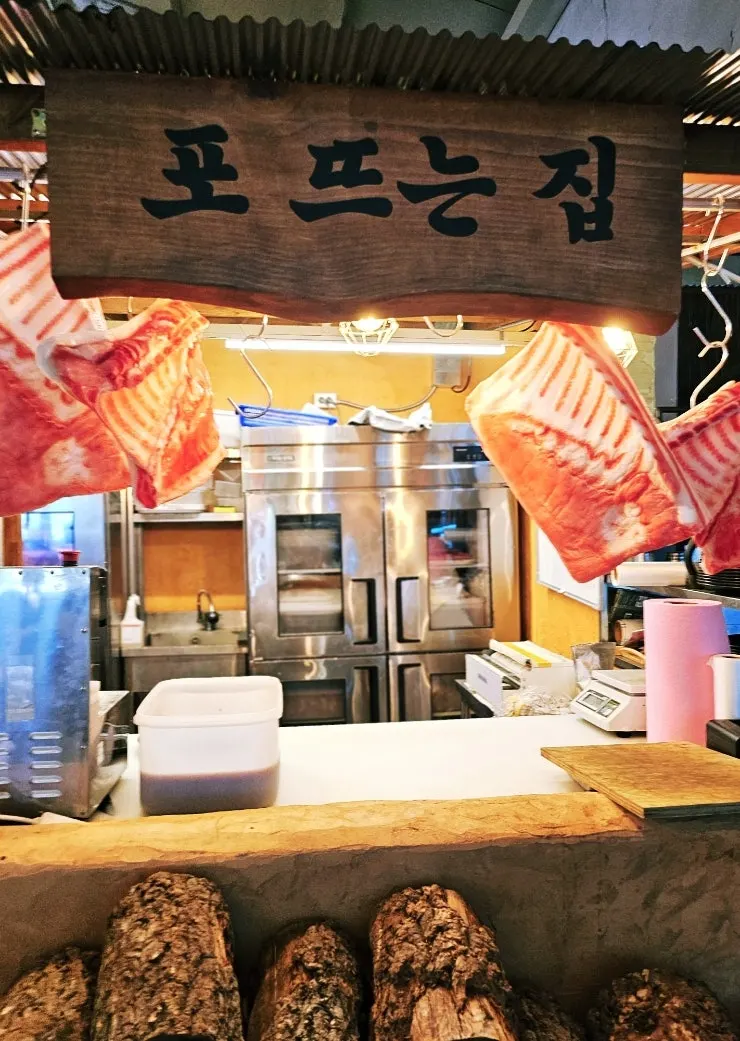 Open kitchen where meat is butchered at Baeksanu Sutbul Wolsong Main Branch