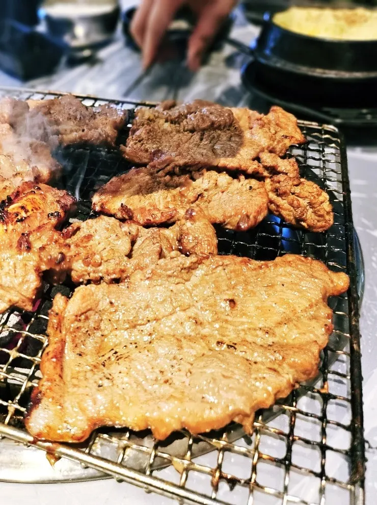 Grilled pork galbi served with wrap greens