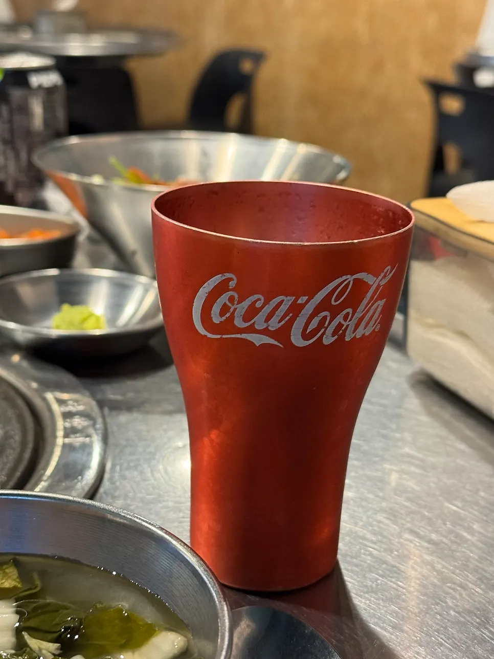 Meat served alongside a Dokbul Janggun cola glass