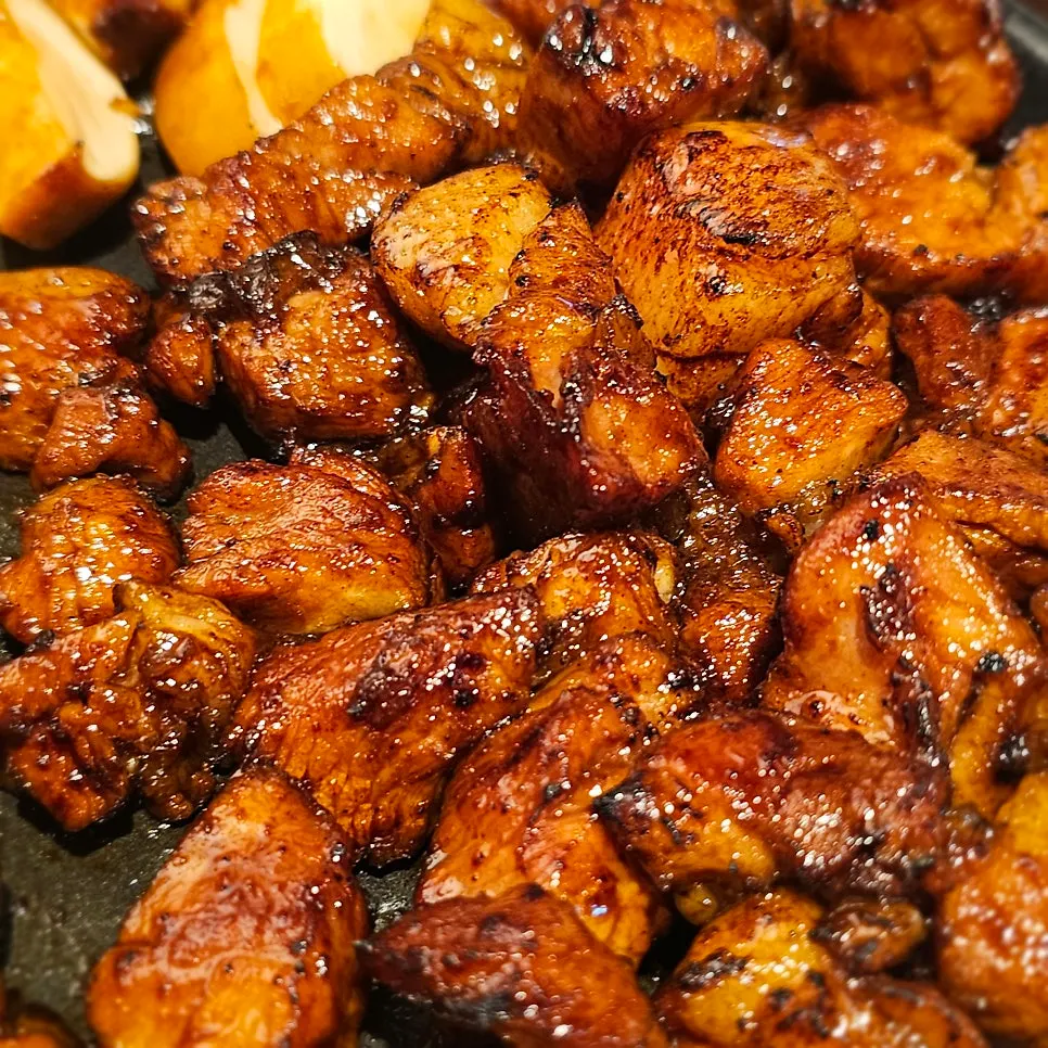 Close-up of evenly seasoned marinated pork